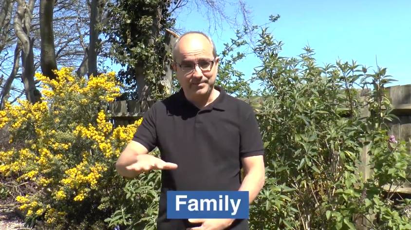 Watch the 'Learn how to sign family using BSL' video on YouTube